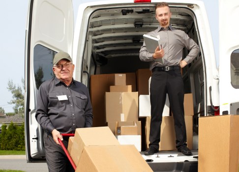 Moving boxes and furniture prepared for flat removals in Hatchend