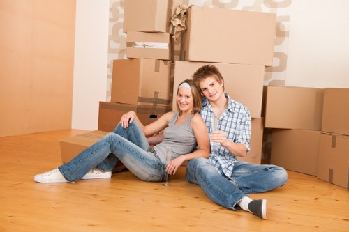 Professional movers handling furniture during a Hatchend house move