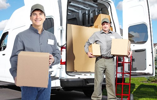 Local removals team loading a van in Hatchend